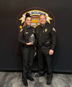 Field Training Officer of the Year Briana Fahy (left) poses with Melbourne's Chief Gillespie (right)