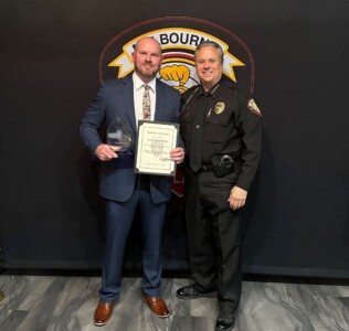 Supervisor of the Year David Helms (left) poses with Melbourne's Chief Gillespie (right)